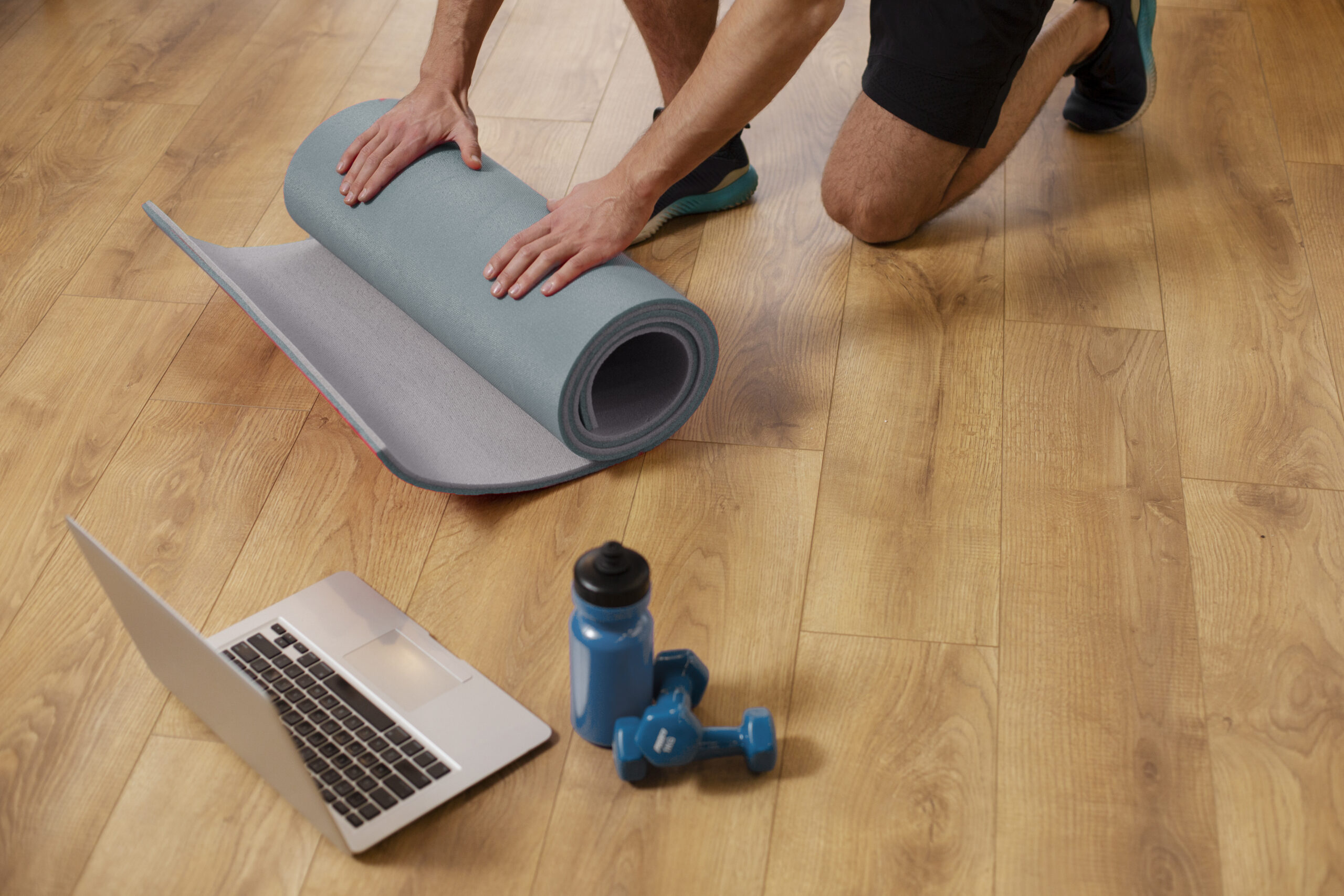 close up hands holding yoga mat